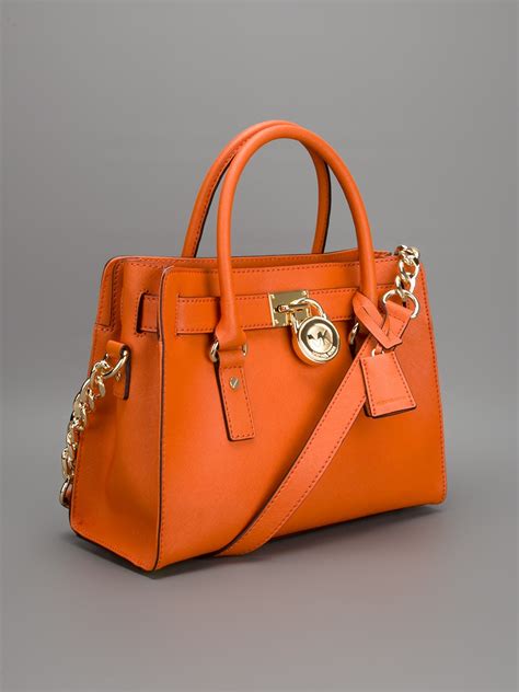 michael kors backpack orange|Michael Kors orange tote.